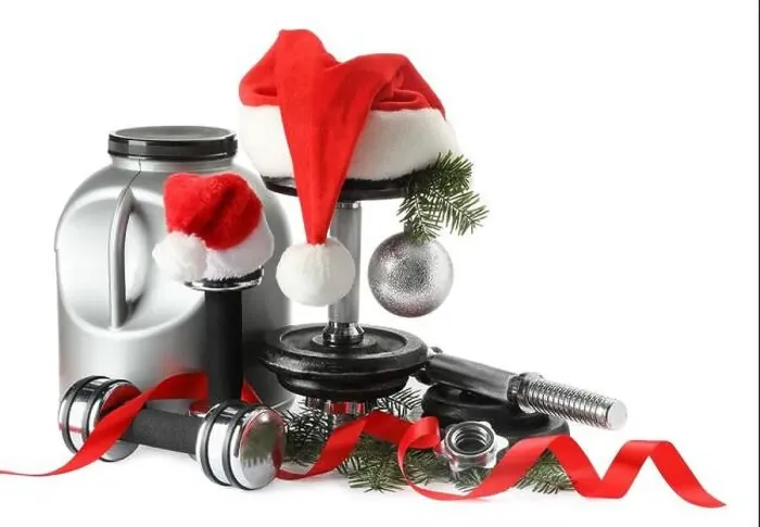 Framed Print : Dumbbells, container with supplement and Christmas decor isolated on white Framed Print : Dumbbells, container with supplement and Christmas decor isolated on white