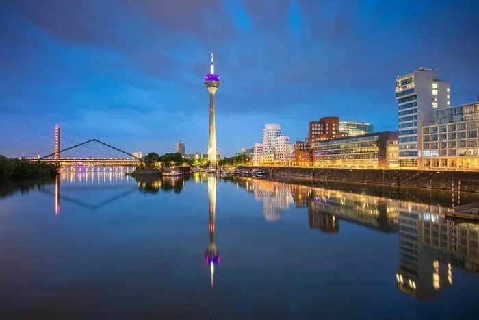 Framed Print : Dusseldorf, Germany. Cityscape image of Düsseldorf, Germany with the Media Harbour and reflection of the city in the Rhine river Framed Print : Dusseldorf, Germany. Cityscape image of Düsseldorf, Germany with the Media Harbour and reflection of the city in the Rhine river