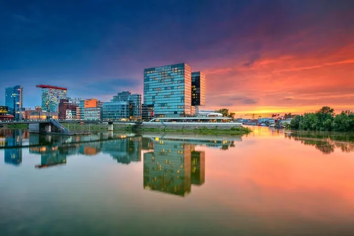 Framed Print : Dusseldorf, Germany. Cityscape image of Düsseldorf with the Media Harbour and reflection of the city in the Rhine river, during twilight Framed Print : Dusseldorf, Germany. Cityscape image of Düsseldorf with the Media Harbour and reflection of the city in the Rhine river, during twilight