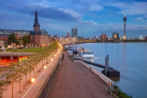 Dusseldorf, Germany. Cityscape image of riverside Düsseldorf, Germany with Rhine river during sunset
