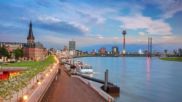 Dusseldorf, Germany. Panoramic cityscape image of riverside Düsseldorf, Germany with Rhine river during sunset
