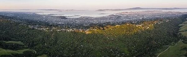 Early morning sunlight illuminates the densely populated area of San Francisco Bay in California. This area supports over 8 million people
