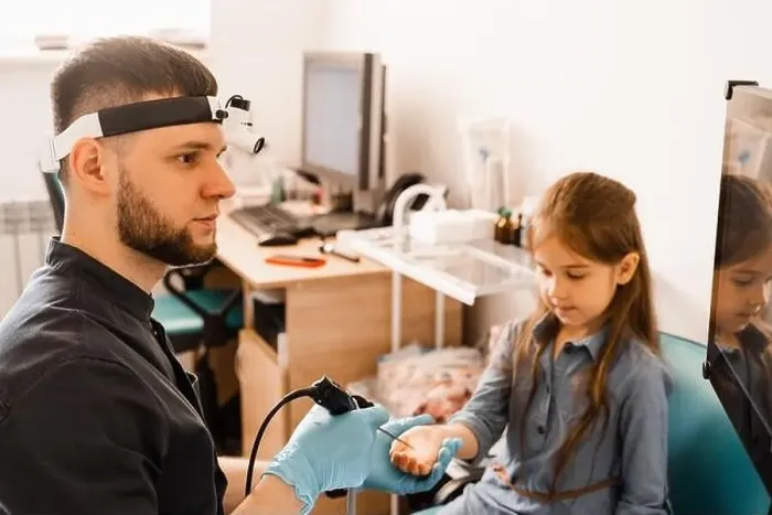 Framed Print : Ears endoscopy of child. Otoscopy procedure with otoscope. ENT doctor otolaryngologist treat ears of girl Framed Print : Ears endoscopy of child. Otoscopy procedure with otoscope. ENT doctor otolaryngologist treat ears of girl