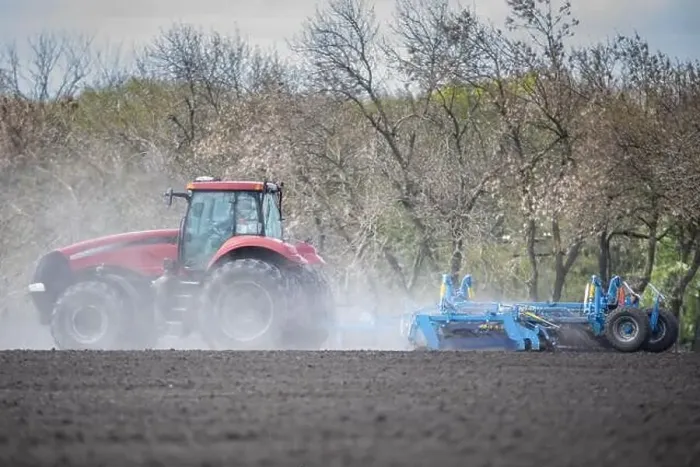 Framed Print : Earth's Canvas: Tractor Cultivating the Landscape Framed Print : Earth's Canvas: Tractor Cultivating the Landscape