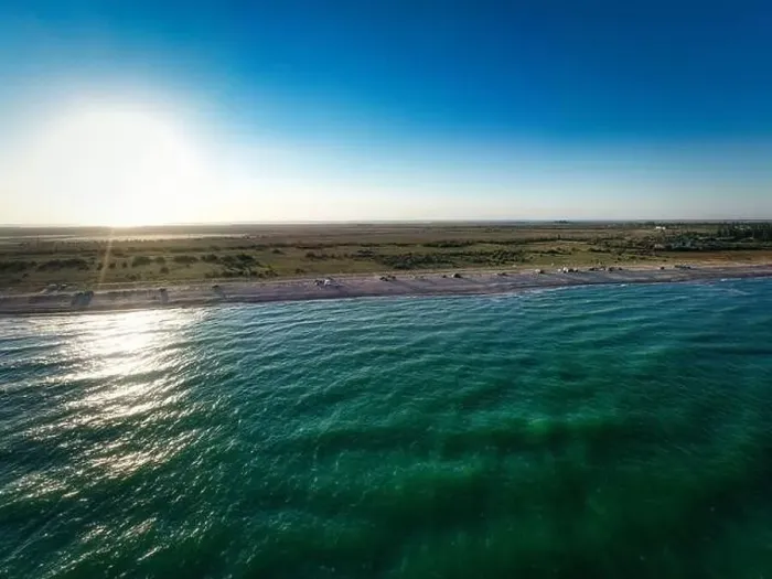 Framed Print : The edge of the sea in the evening sun. Camping beach. Drone shot 4K Framed Print : The edge of the sea in the evening sun. Camping beach. Drone shot 4K