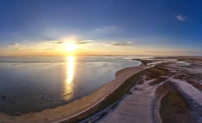Framed Print : The edge of the sea in the evening sun. Camping beach. Drone shot 4K Framed Print : The edge of the sea in the evening sun. Camping beach. Drone shot 4K