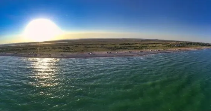 Framed Print : The edge of the sea in the evening sun. Camping beach. Drone shot 4K Framed Print : The edge of the sea in the evening sun. Camping beach. Drone shot 4K
