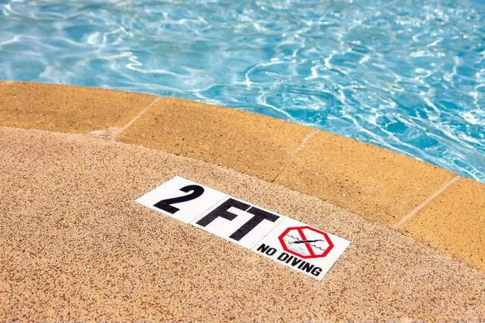 Framed Print : Edge of swimming pool with NO Diving warning sign and 2 ft depth marker Framed Print : Edge of swimming pool with NO Diving warning sign and 2 ft depth marker