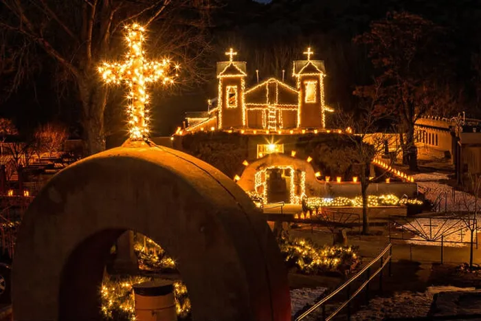Framed Print : El Santuario de Chimayo Historic Site illuminated by hundreds of small paper lanterns known as luminaria to celebrate Framed Print : El Santuario de Chimayo Historic Site illuminated by hundreds of small paper lanterns known as luminaria to celebrate
