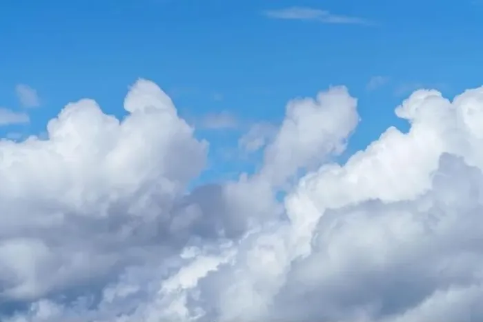 Framed Print : The electric blue sky is adorned with fluffy white cumulus clouds Framed Print : The electric blue sky is adorned with fluffy white cumulus clouds