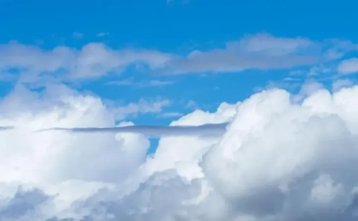 Framed Print : The electric blue sky is adorned with fluffy white cumulus clouds Framed Print : The electric blue sky is adorned with fluffy white cumulus clouds