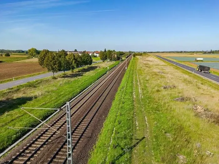 Framed Print : An electric railroad line with tracks next to two roads in a rural area, Germany Framed Print : An electric railroad line with tracks next to two roads in a rural area, Germany