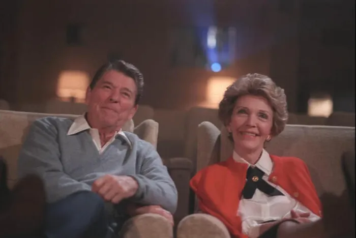 Framed Print : English: President Reagan and Nancy Reagan watching a film in the White House Theater Framed Print : English: President Reagan and Nancy Reagan watching a film in the White House Theater
