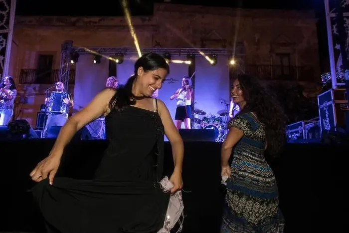 Framed Print : Enjoying and dancing to pizzica (traditional Salento music) in Uggiano la Chiesa, Puglia, Italy Framed Print : Enjoying and dancing to pizzica (traditional Salento music) in Uggiano la Chiesa, Puglia, Italy