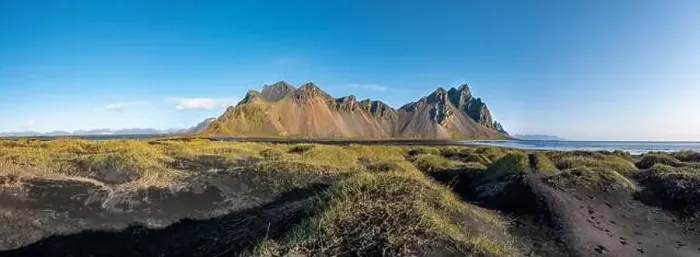 Framed Print : Epic aerial drone view flying over landscape of the black sand beach in Stokksnes on a sunny day Framed Print : Epic aerial drone view flying over landscape of the black sand beach in Stokksnes on a sunny day