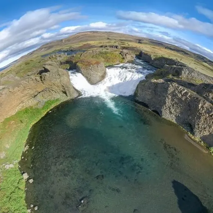 Framed Print : Epic aerial drone view flying over landscape of Hjalparfoss waterfall and lagoon on a sunny day Framed Print : Epic aerial drone view flying over landscape of Hjalparfoss waterfall and lagoon on a sunny day