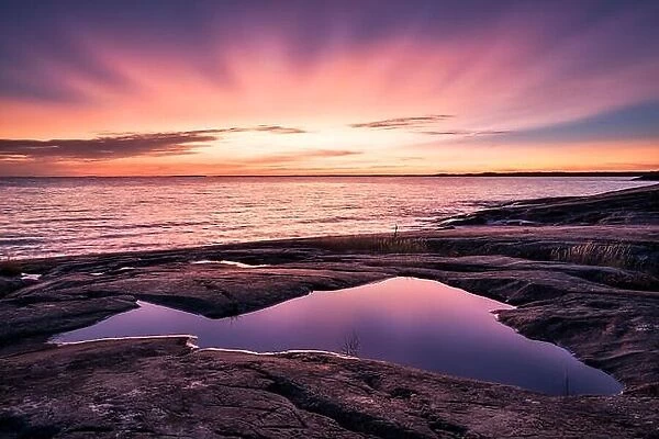 Epic sunset with beautiful color and sea at autumn evening in Porkkalanniemi, Finland