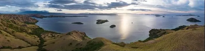 Framed Print : Evening light illuminates Rinca Island in Komodo National Park, Indonesia. In close proximity to Komodo Island, Rinca is home to many Komodo dragons Framed Print : Evening light illuminates Rinca Island in Komodo National Park, Indonesia. In close proximity to Komodo Island, Rinca is home to many Komodo dragons