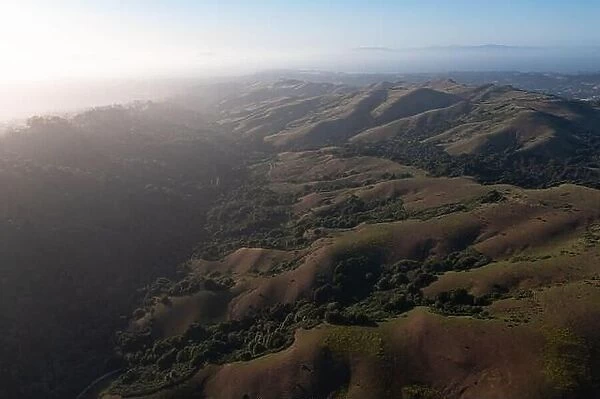 Evening sunlight shine on the serene, rolling hills of the East Bay, just east of San Francisco Bay, California. This area abuts Oakland and Berkeley