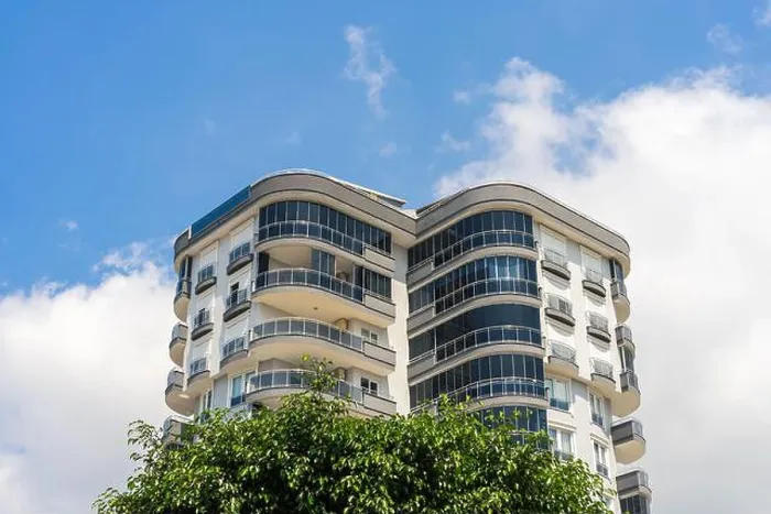 Framed Print : Exterior of a high-rise apartment building. Large balconies. Sunny day. Residential Properties