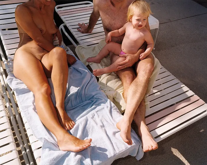 Framed Print : A family of nudists relax on holiday Framed Print : A family of nudists relax on holiday