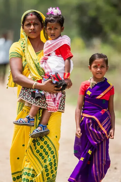 Framed Print : A family walks together in Pan Bari Village in the Kaziranga National Park in India on the 13th April 2016 Framed Print : A family walks together in Pan Bari Village in the Kaziranga National Park in India on the 13th April 2016