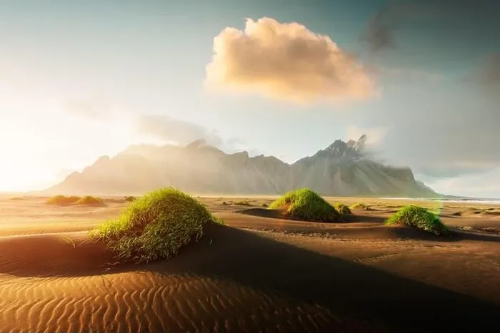 Framed Print : Famous grass hills on black desert near Stokksnes mountains. Vestrahorn cape, Iceland. Landscape photography