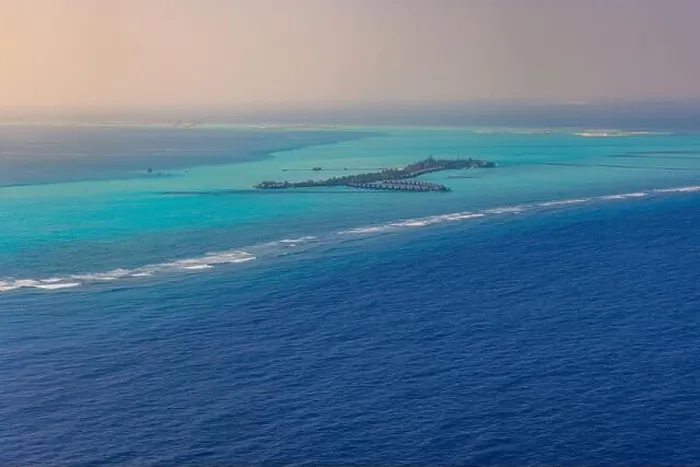 Framed Print : Fantastic aerial landscape, luxury tropical resort or hotel with water villas and beautiful beach scenic. Amazing bird eyes view in Maldives landscape
