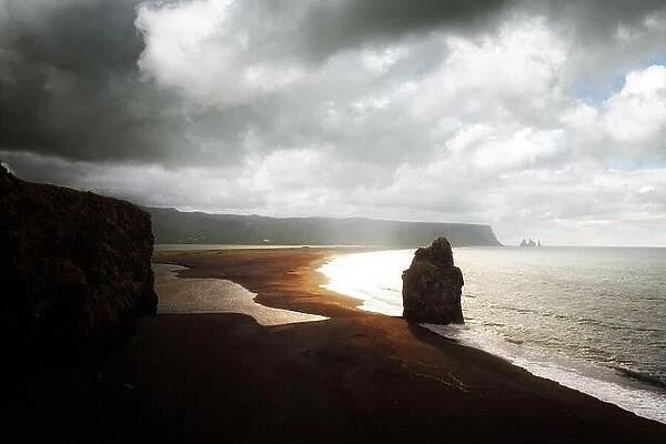 Fantastic landscape with rocks and Atlantic ocean from southern coast of Iceland. Black beach, Reynisdrangar, Vik