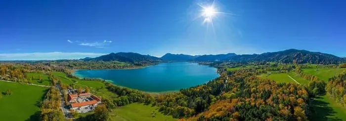 Framed Print : Fantastic panoramic view over the bavarian lake Tegernsee in autumn with fall colors, made by a drone Framed Print : Fantastic panoramic view over the bavarian lake Tegernsee in autumn with fall colors, made by a drone