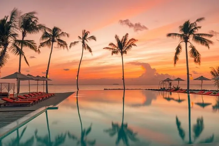 Framed Print : Fantastic poolside, sunset sky, palm trees reflection. Luxury tropical beach landscape, infinity swimming pool, deck chairs bed under umbrellas Framed Print : Fantastic poolside, sunset sky, palm trees reflection. Luxury tropical beach landscape, infinity swimming pool, deck chairs bed under umbrellas