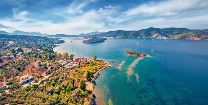 Framed Print : Fantastic summer view of Plaka beach and Poros town on background Framed Print : Fantastic summer view of Plaka beach and Poros town on background