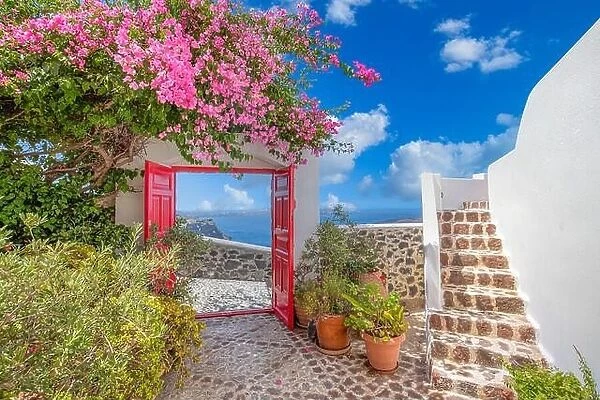 Fantastic travel background, Santorini urban landscape. Red door or gate with stairs and white architecture under blue sky. Idyllic summer vacation