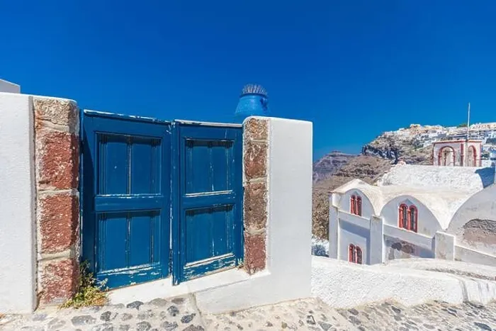 Framed Print : Fantastic travel background, Santorini urban landscape. Blue door or gate with stairs and white architecture under blue sky. Idyllic summer vacation Framed Print : Fantastic travel background, Santorini urban landscape. Blue door or gate with stairs and white architecture under blue sky. Idyllic summer vacation