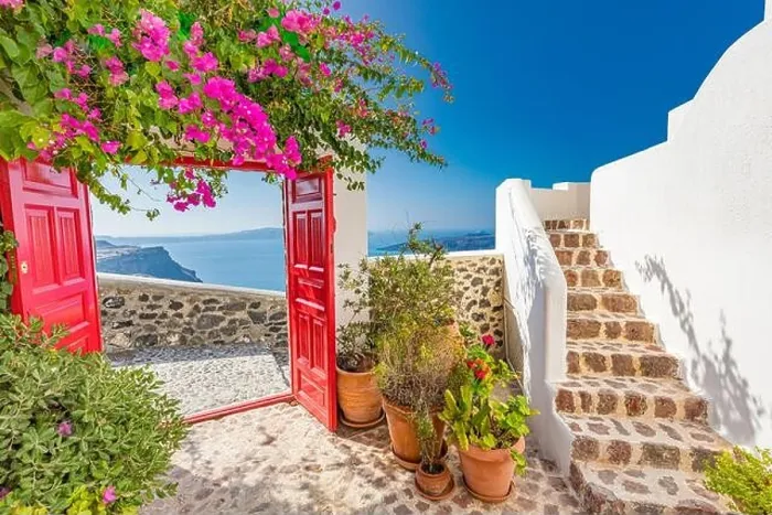 Framed Print : Fantastic travel background, Santorini urban landscape. Red door, gate with stairs white architecture under blue sky. Idyllic summer vacation luxury Framed Print : Fantastic travel background, Santorini urban landscape. Red door, gate with stairs white architecture under blue sky. Idyllic summer vacation luxury