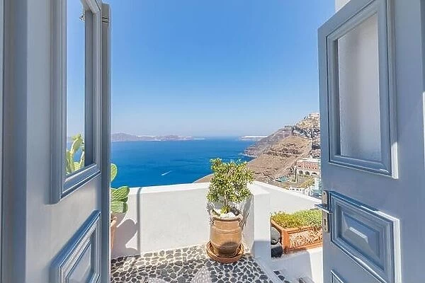Fantastic travel panorama, Santorini urban street landscape. Door or gate stairs and white architecture under sunny sky. Amazing summer vacation