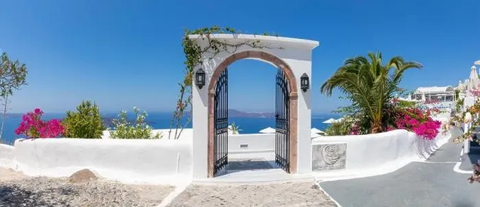 Framed Print : Fantastic travel panorama, Santorini urban street landscape. Door or gate stairs and white architecture under sunny sky. Amazing summer vacation Framed Print : Fantastic travel panorama, Santorini urban street landscape. Door or gate stairs and white architecture under sunny sky. Amazing summer vacation