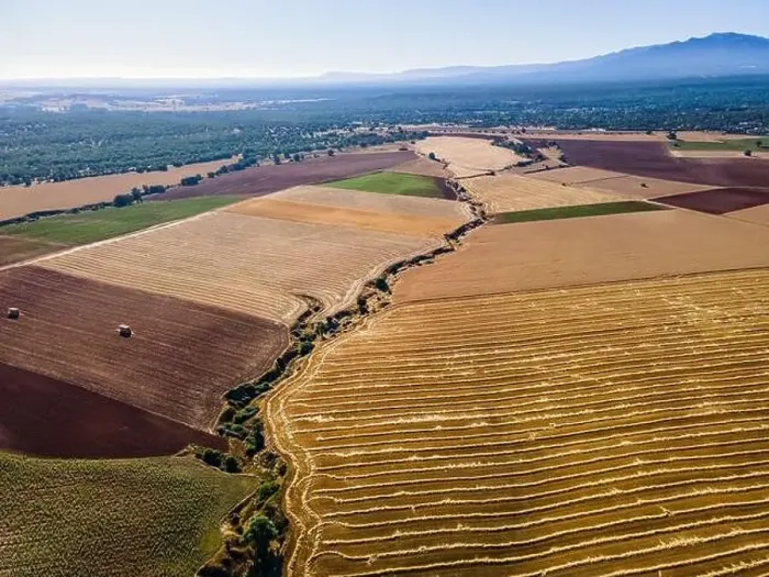 Framed Print : Farm fields at the foot of the mountains at sunrise on a summer day. Segovia Framed Print : Farm fields at the foot of the mountains at sunrise on a summer day. Segovia
