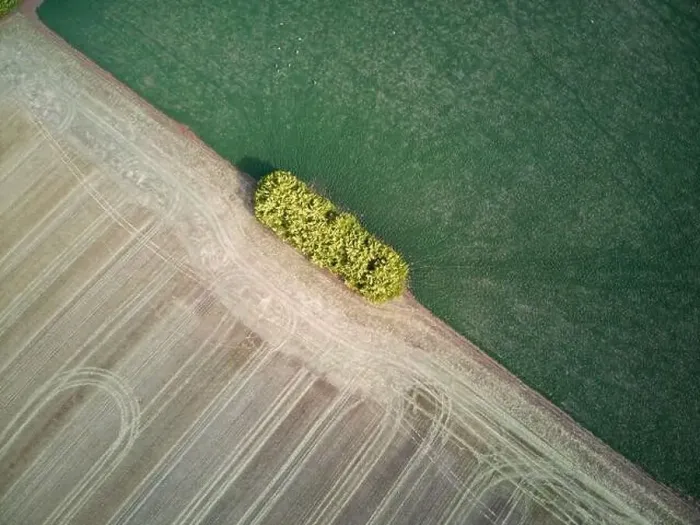 Framed Print : Farmland aerial view different fields showing agricultural crop patterns and tracks with a green and brown background Framed Print : Farmland aerial view different fields showing agricultural crop patterns and tracks with a green and brown background