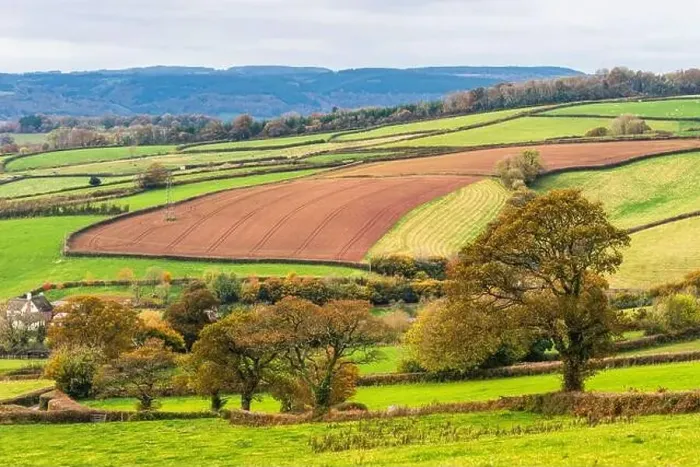 Framed Print : Farmlands, Meadows and Fields over Devon in the colors of fall, England, Europe Framed Print : Farmlands, Meadows and Fields over Devon in the colors of fall, England, Europe