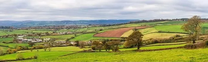 Framed Print : Farmlands, Meadows and Fields over Devon in the colors of fall, England, Europe Framed Print : Farmlands, Meadows and Fields over Devon in the colors of fall, England, Europe