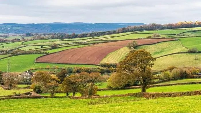 Framed Print : Farmlands, Meadows and Fields over Devon in the colors of fall, England, Europe Framed Print : Farmlands, Meadows and Fields over Devon in the colors of fall, England, Europe