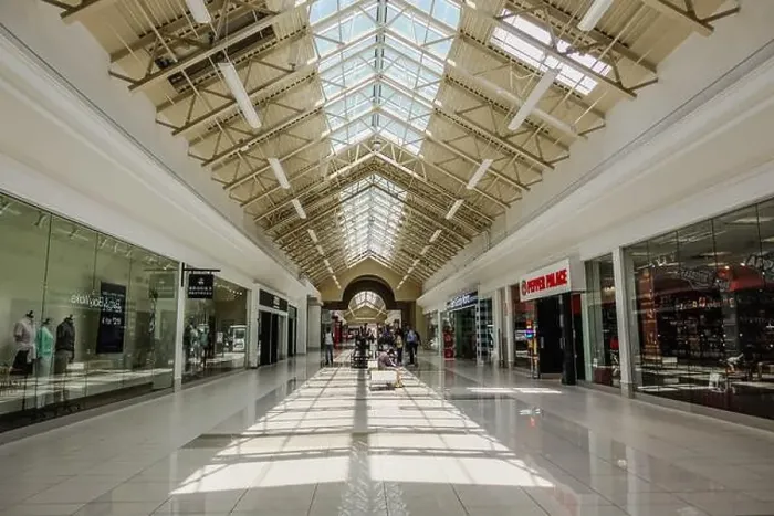 Framed Print : Fashion Outlets of Niagara Falls USA is a contemporary shopping mall with outlet stores from well-known retailers Framed Print : Fashion Outlets of Niagara Falls USA is a contemporary shopping mall with outlet stores from well-known retailers
