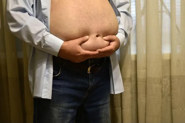 Framed Print : Fat man with a big belly. High quality photo Framed Print : Fat man with a big belly. High quality photo