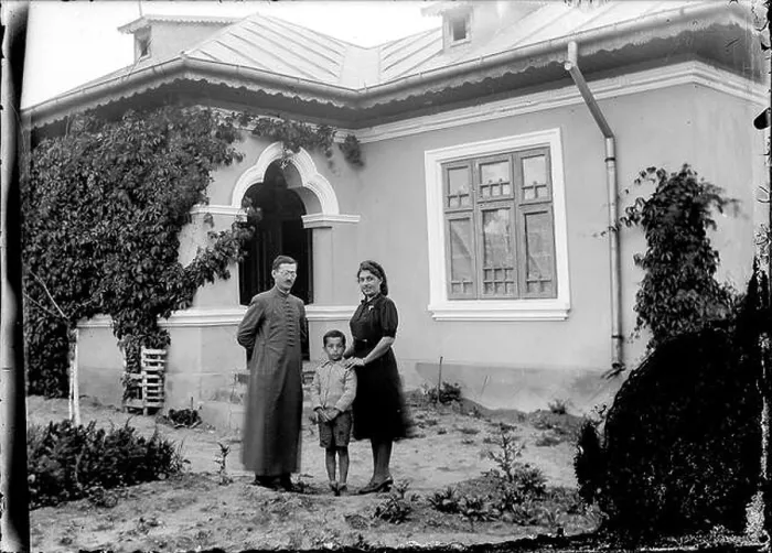 Framed Print : Father Marin Alexandrescu with his wife Ana and eldest son in front of their house in Slobozia