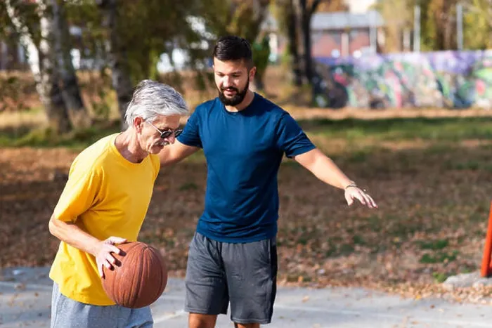 Framed Print : Father and son playing basketball in the park Framed Print : Father and son playing basketball in the park