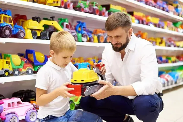 Framed Print : Father and son in a toy store Framed Print : Father and son in a toy store