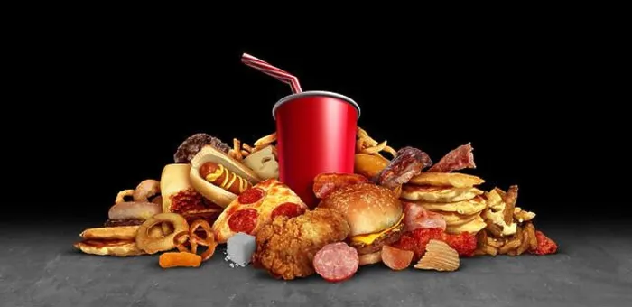 Framed Print : Fattening junk food as fried foods hamburgers soft drinks leading to health risks as obesity Framed Print : Fattening junk food as fried foods hamburgers soft drinks leading to health risks as obesity