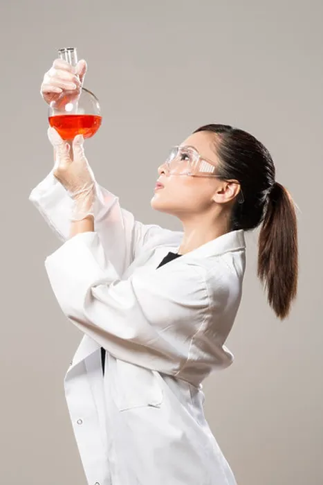 Framed Print : Female Chinese Healthcare professional or scientific researcher looking at a row of test tubes Framed Print : Female Chinese Healthcare professional or scientific researcher looking at a row of test tubes