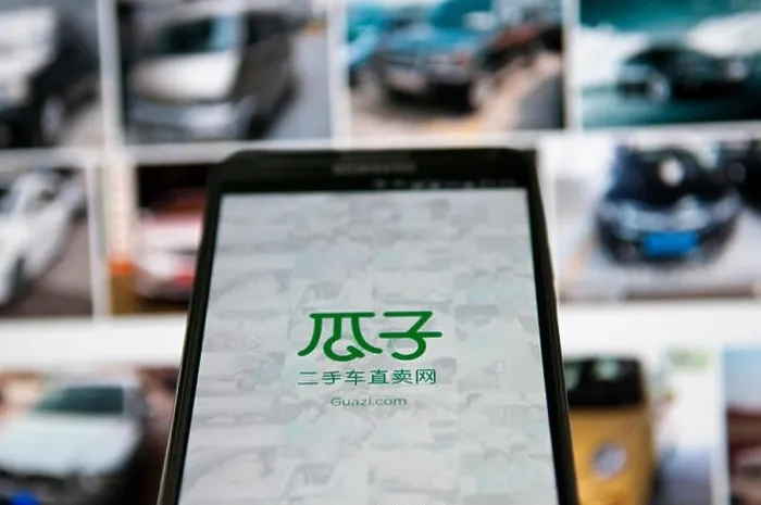 Framed Print : FILE--A Chinese mobile phone user uses the app of China's largest used-car trading platform Guazi Framed Print : FILE--A Chinese mobile phone user uses the app of China's largest used-car trading platform Guazi